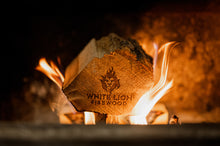 Load image into Gallery viewer, Firewood and kindling on fire inside a stove.
